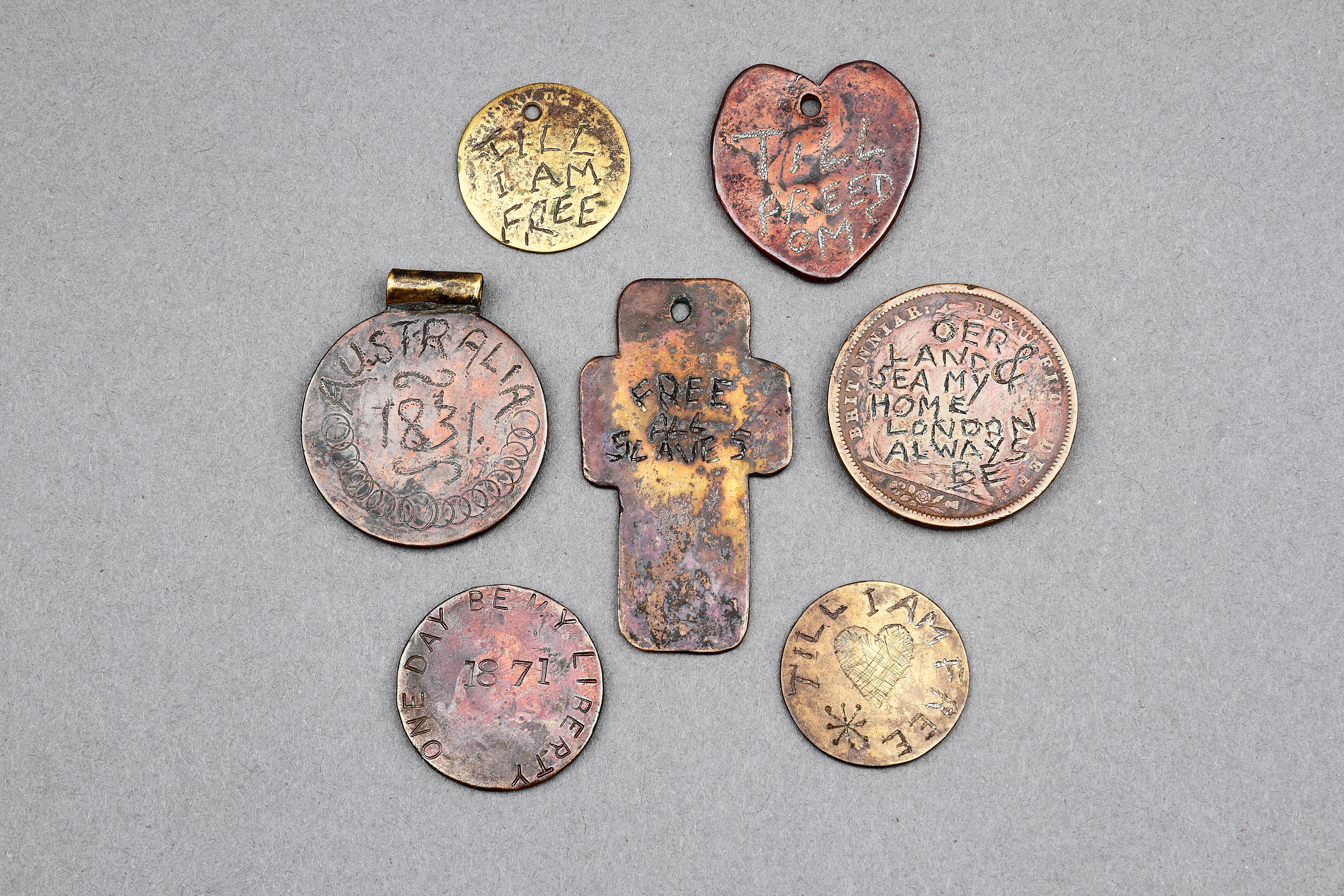 A Rare Collection of Seven Slave ‘Prisoner’ Tokens 